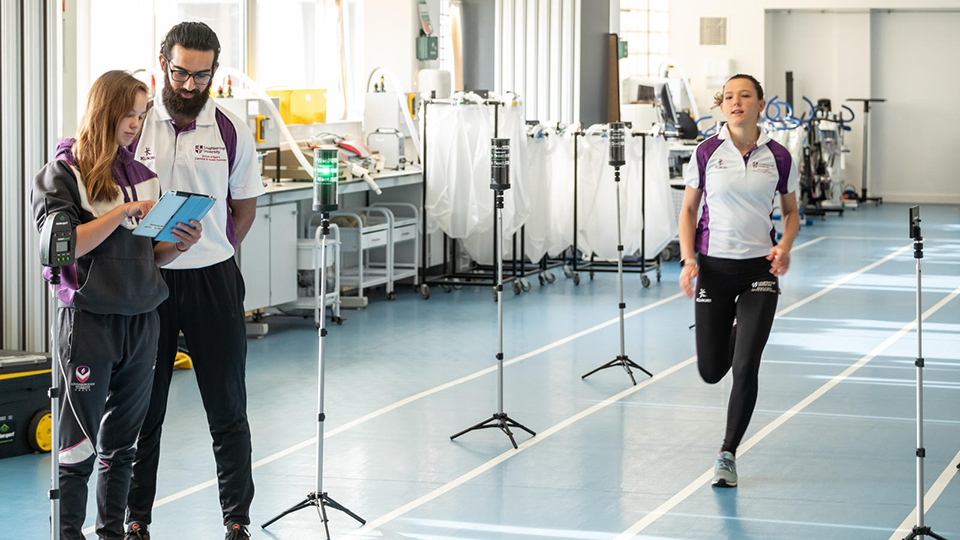 Students analysing athletes during a practical session