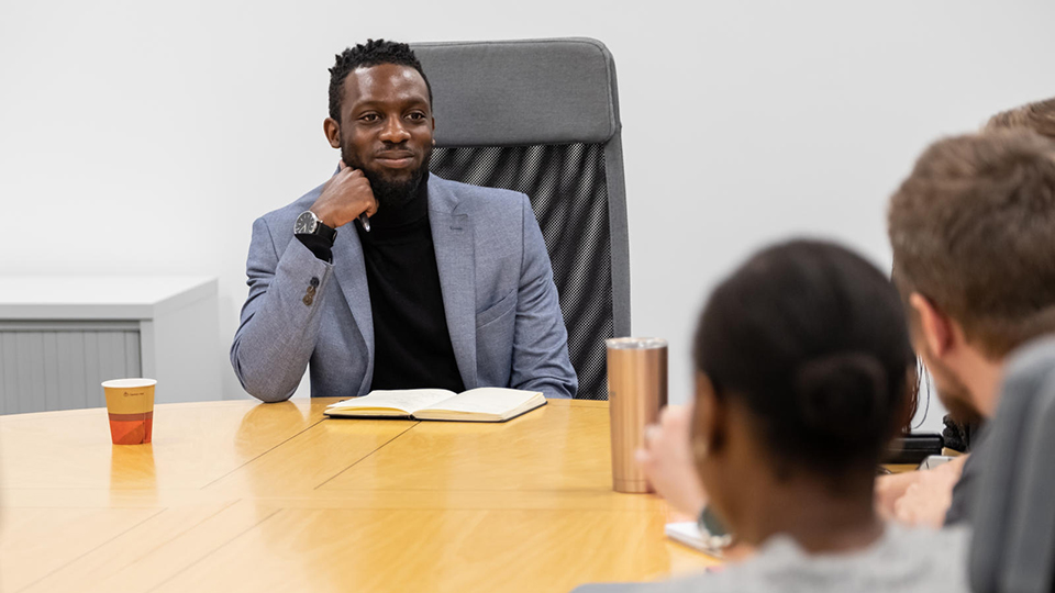 Student in a business meeting