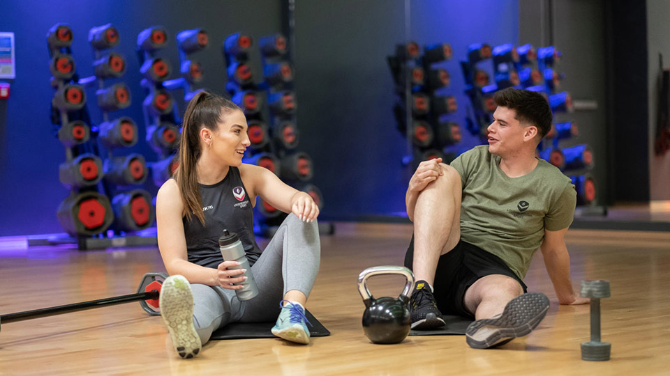 Students talking in gym