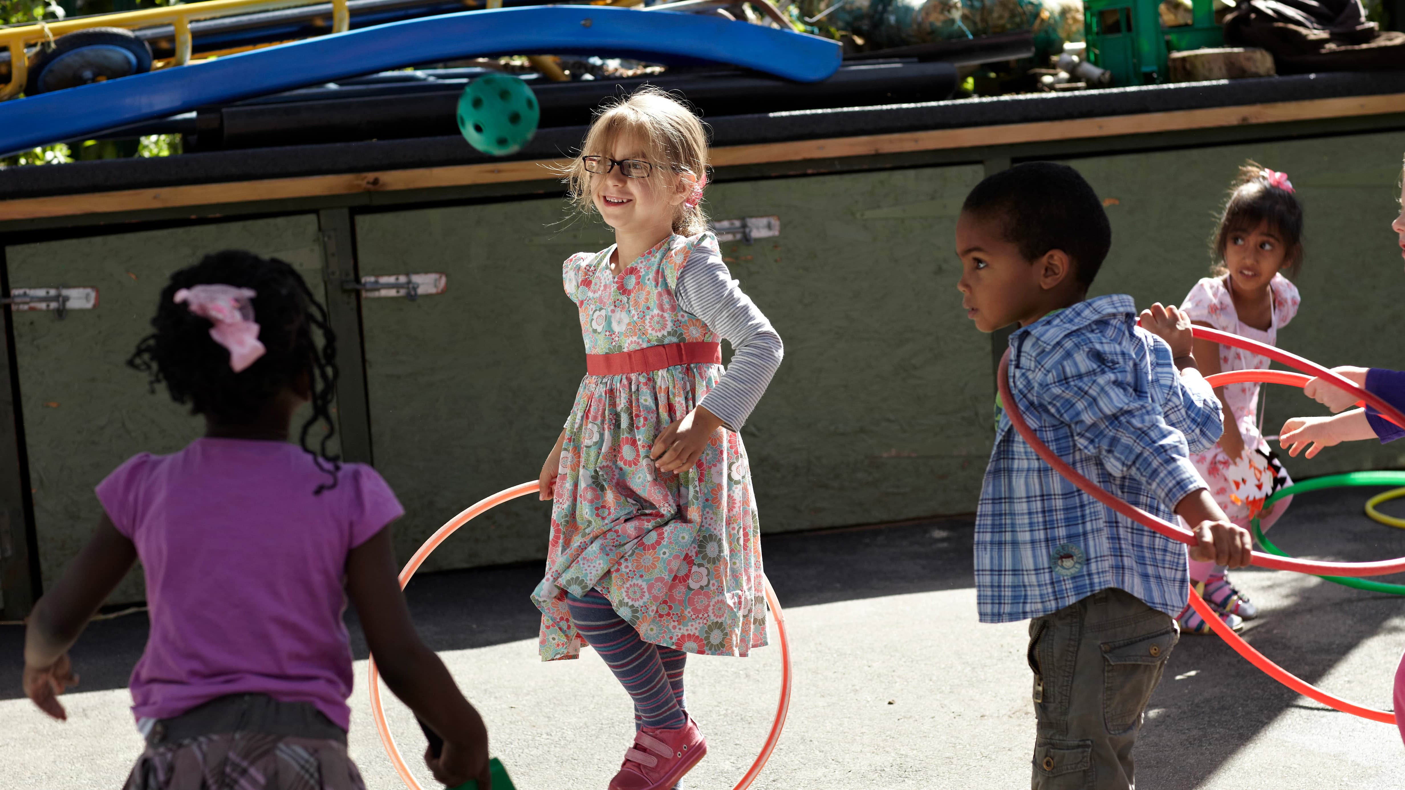 A group of young children playing in a playground