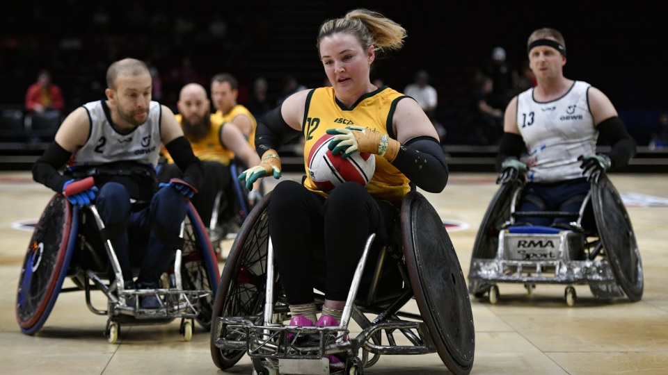 Wheelchair rugby players in action