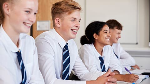 A group of young people sitting in school