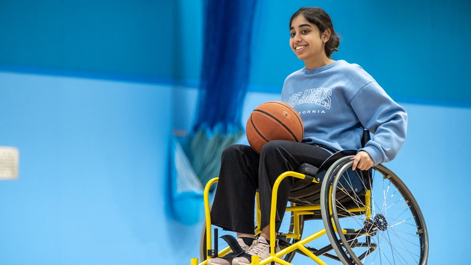 Student playing wheelchair basketball