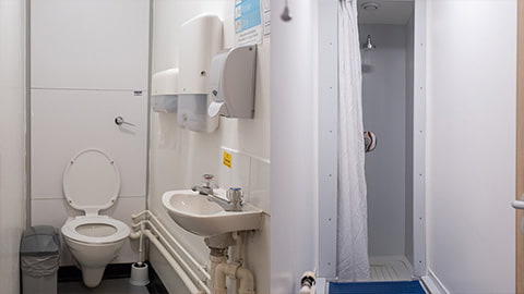 Shared bathroom facilities in David Collett halls of residence with separate toilets and showers.