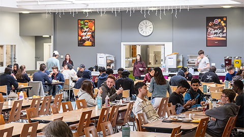 Elvyn Richards dining hall with rows of tables with students eating meals