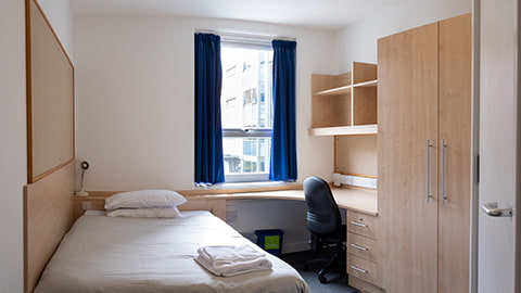 Modern student accommodation Hazlerigg-Rutland bedroom with large desk, wardrobe and plenty of storage space