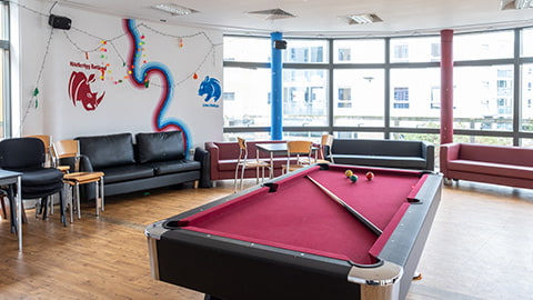 Common room at Hazlerigg-Rutland equipped with seating areas and pool table