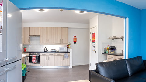 Spacious and fully equipped kitchen in Hazlerigg-Rutland student accommodation at Loughborough University, complete with a comfy seated dining area