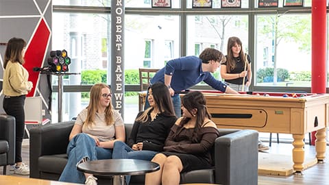 Students socialising together in the Robert Bakewell common room