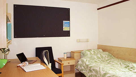 Bedroom in catered Loughborough University hall Royce with comfy bed and study desk
