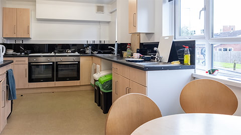 Standard kitchen in Telford self-catered halls of residence at Loughborough University, equipped with ovens, hobs, toaster, microwave and plenty of cupboard space