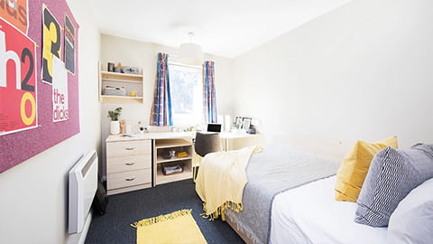Stylish and modern bedroom in The Holt Loughborough University accommodation with comfy bed and study desk