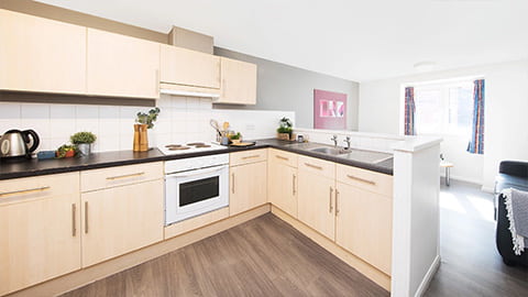 Fully equipped kitchen at The Holt with plenty of cupboard space, ovens, fridges and a large seating area