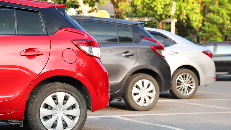 A side-on view of a row of parked cars
