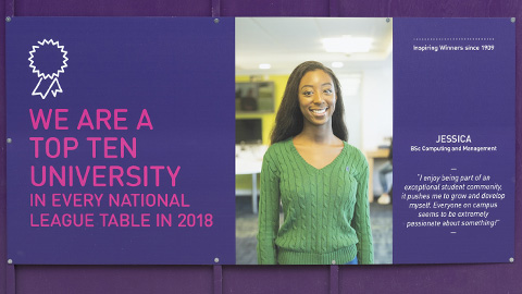 billboard with text and photograph