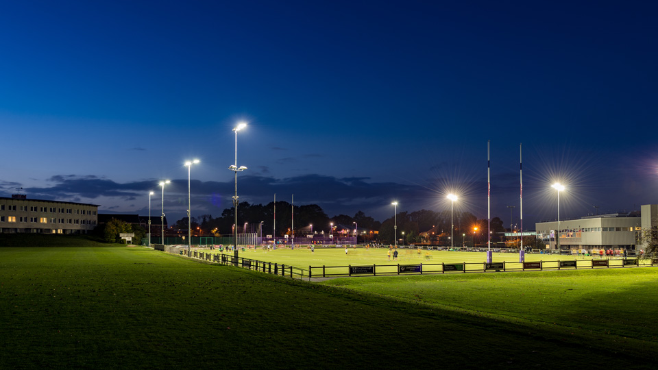 Rugby pitch at night with floodlights
