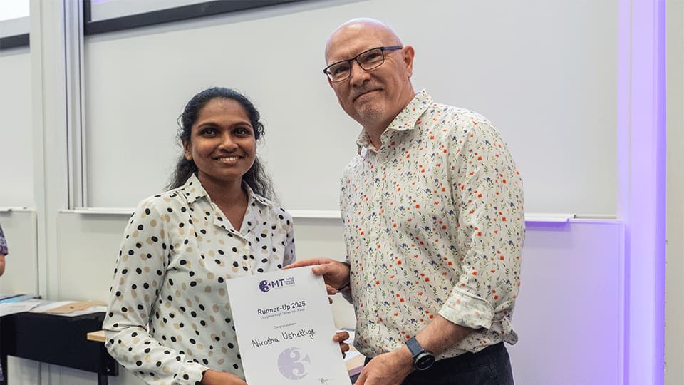 Nirosha Ushettige receiving a certificate
