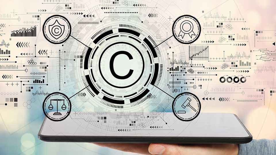 An image showing a person holding an electronic tablet, with a C for copyright in the middle.