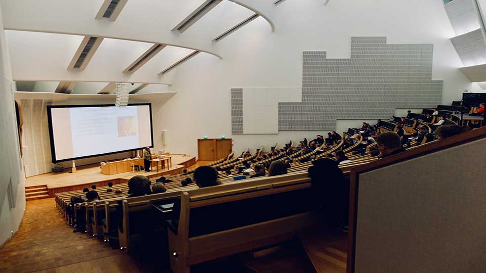 An auditorium with students attending a lecture