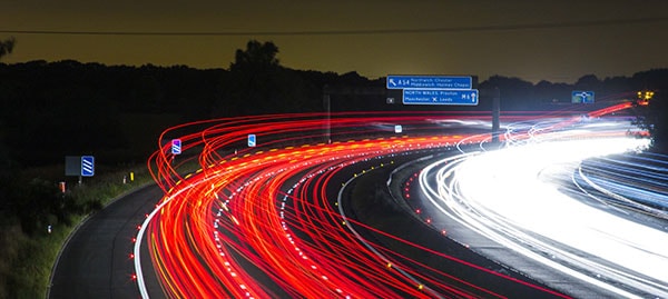 Car lights on motorway at night