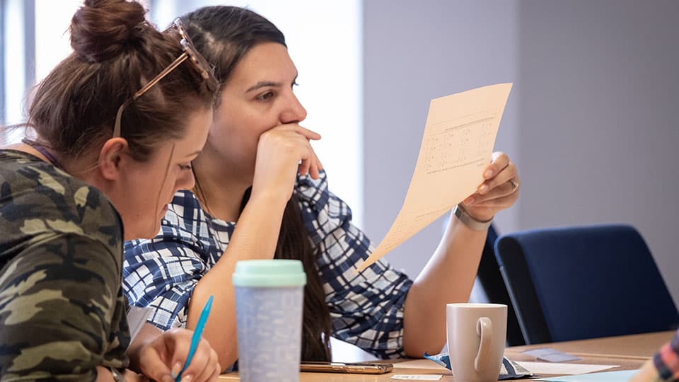 two conference delegates having a discussion