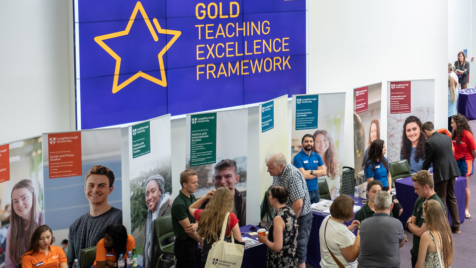 open day crowds with department marketing displays in the background