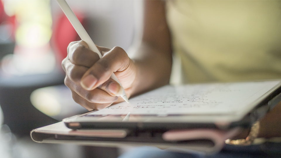 girl using an ipad for note taking