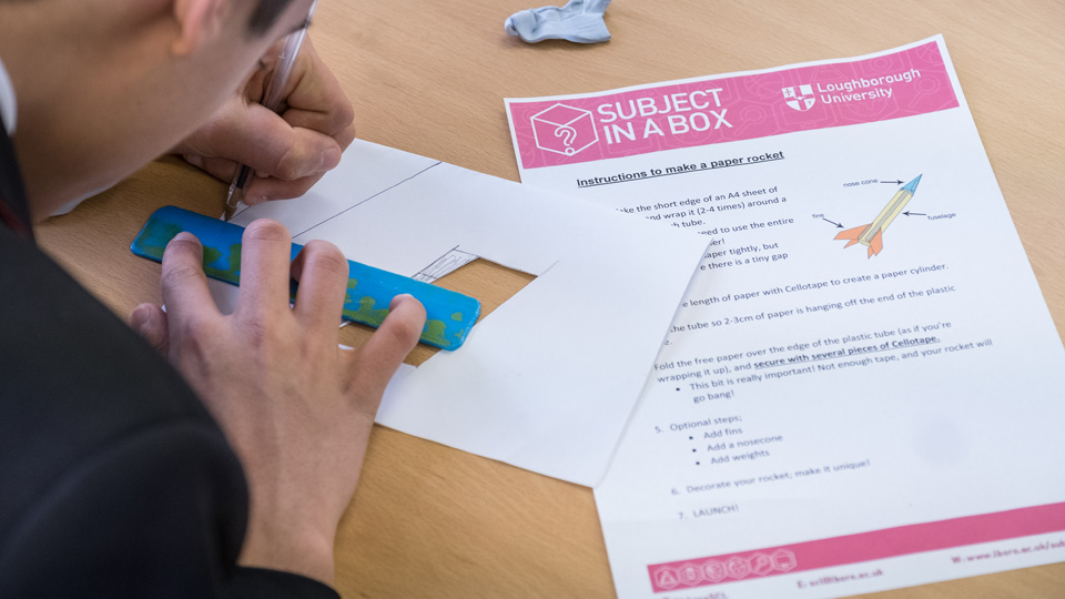 a pupil working on the rocket subject in a box