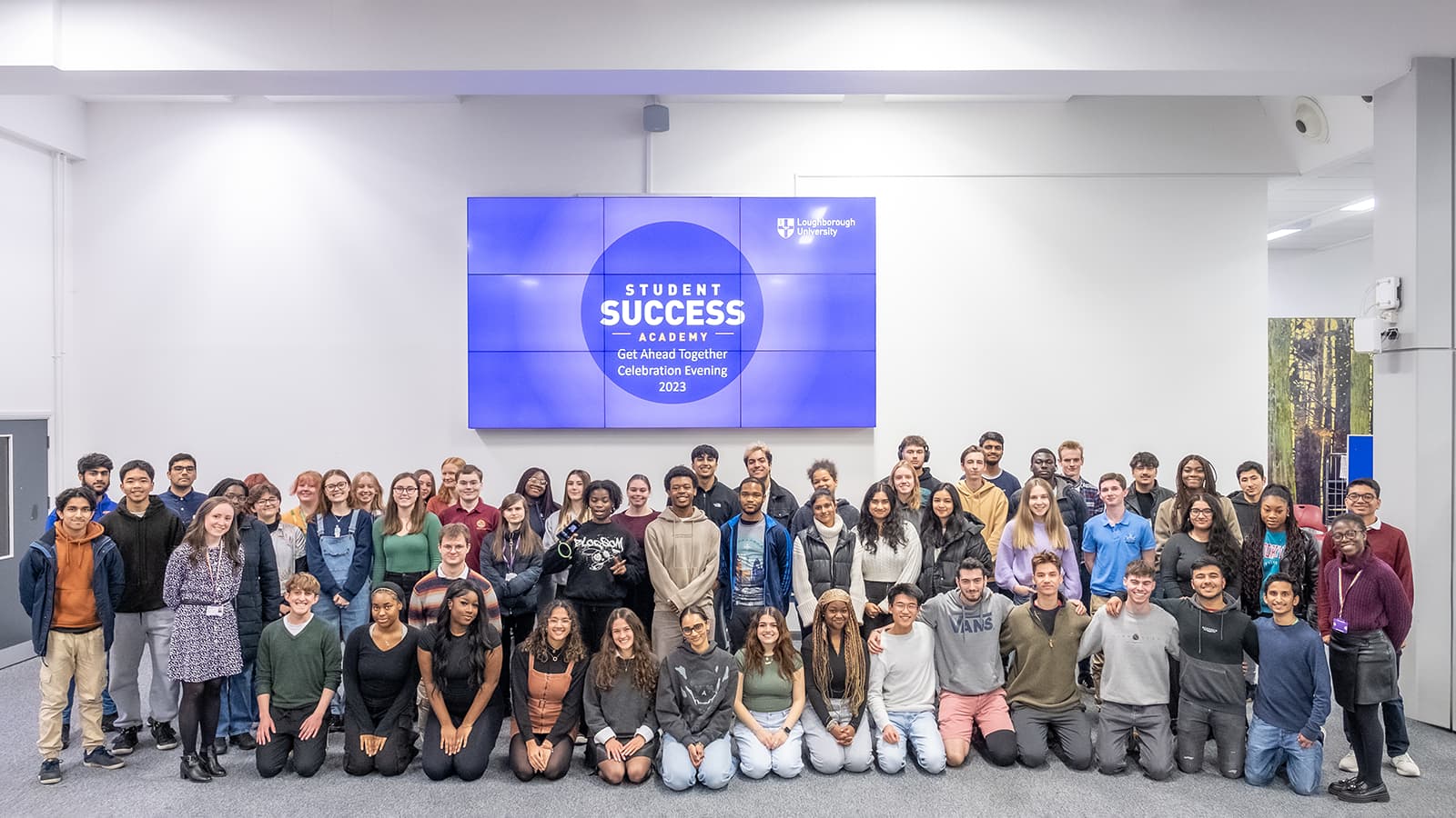 A large number of students, arranged for a photo, at the Get Ahead Together Celebration evening 2023
