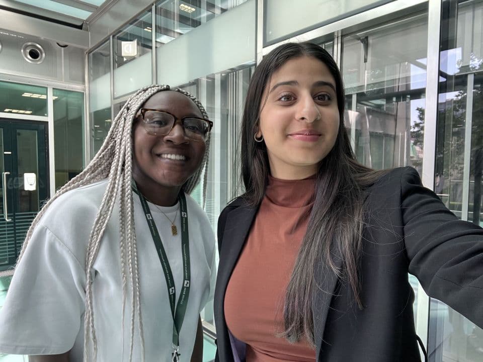 A student stood with their Alumni Mentor