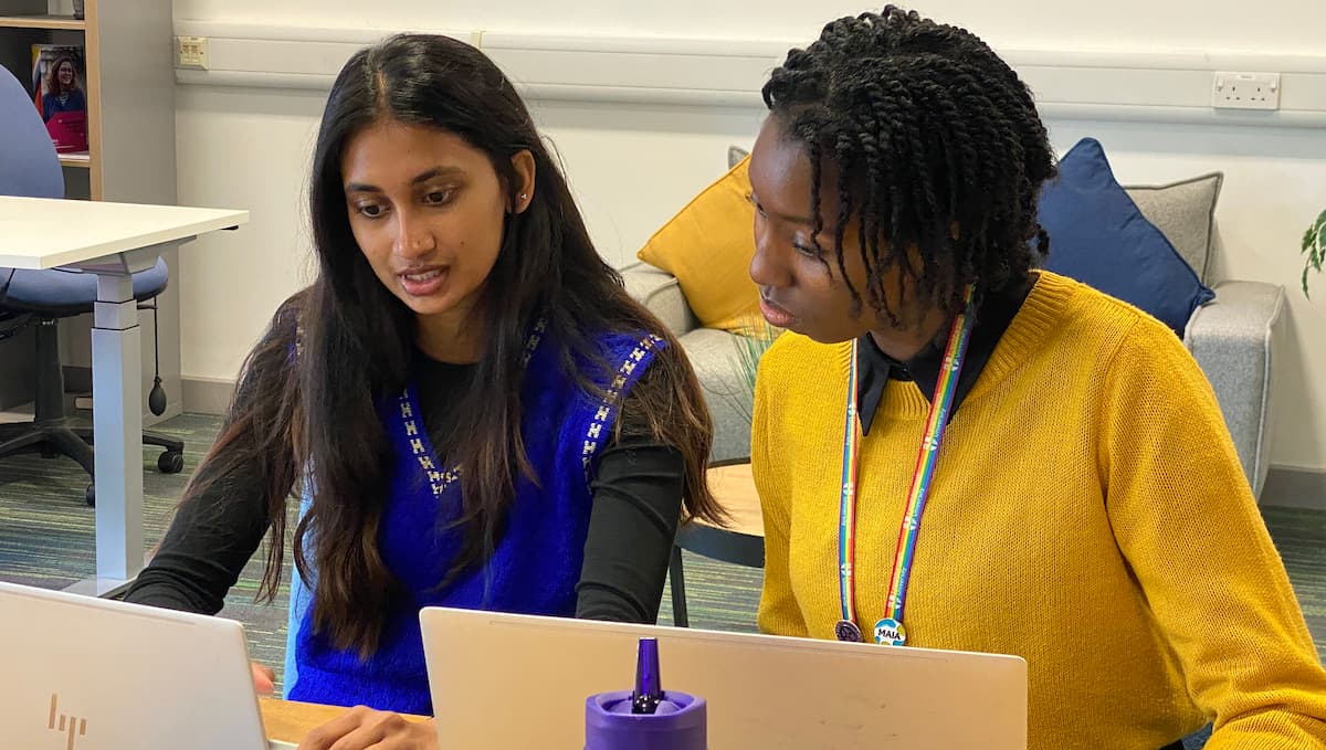 A student and staff member sat at desks in an appointment