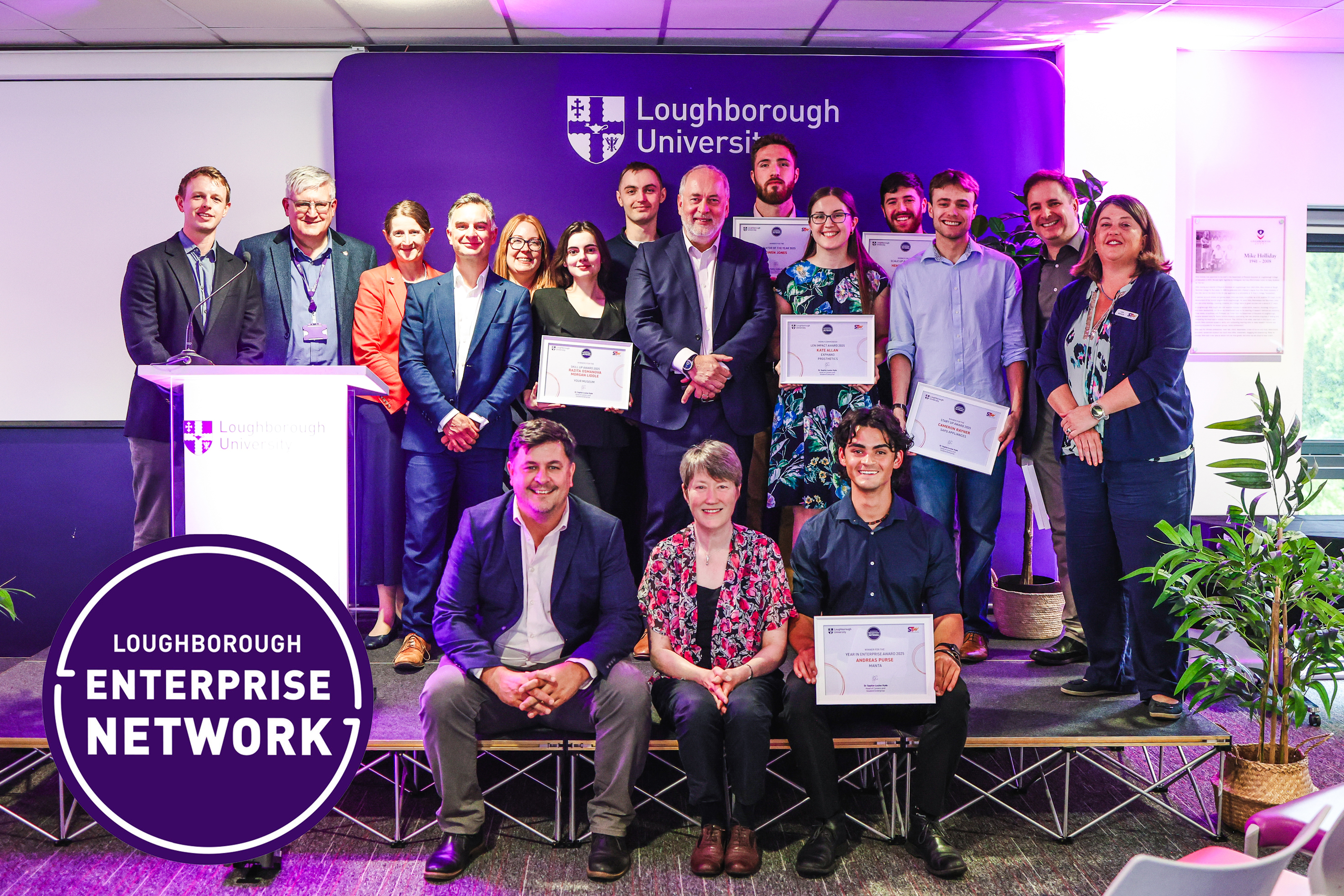 Staff and students posing at a celebration event