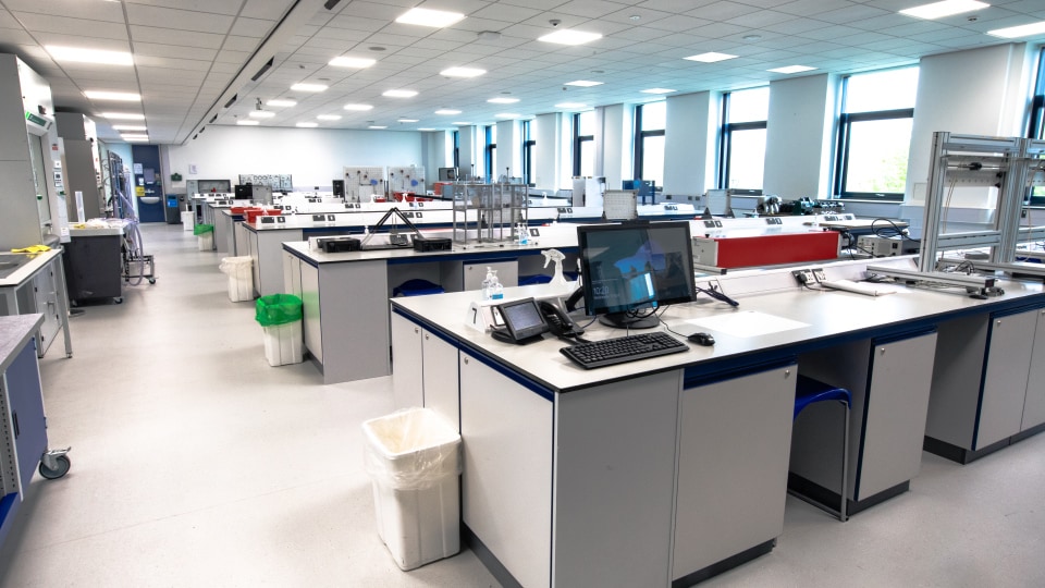 West Park Labs WPL106 - Spacious specialist lab with multiple workstations, computers, and equipment. Bright lighting, large windows, and organized layout for teaching.
