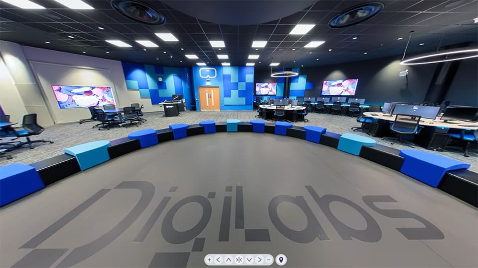 View of the WPT008 Digilabs West space with robot area, desks, PCs and big screens.