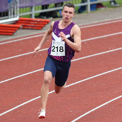 Chris O'Donnell running on the athletics track