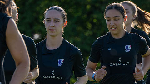 Two of our Lightning football players are running in training.