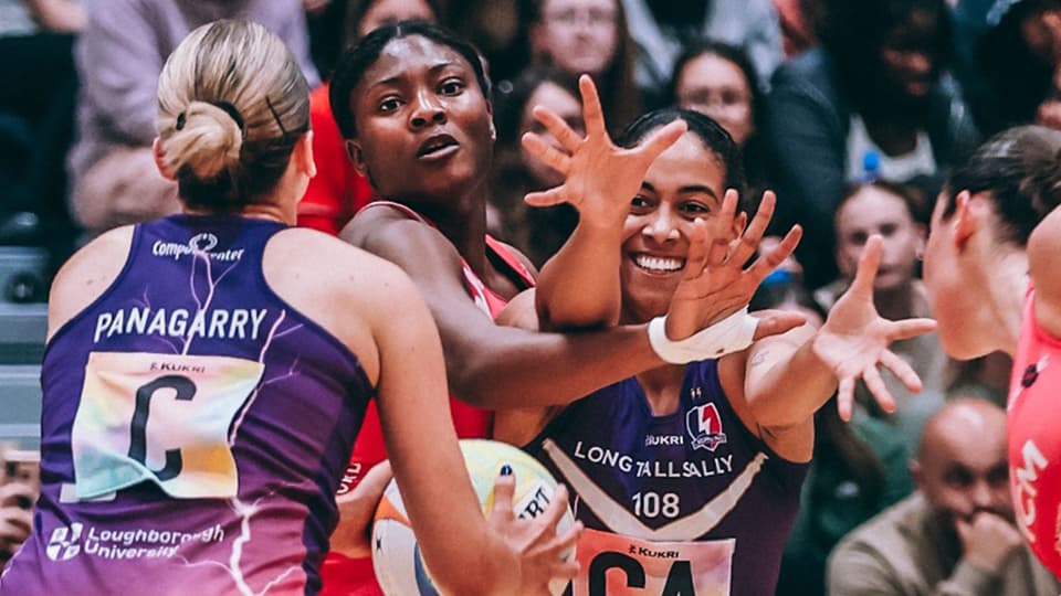 three netball players on the court