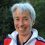 A headshot of Emma Mitchell smiling