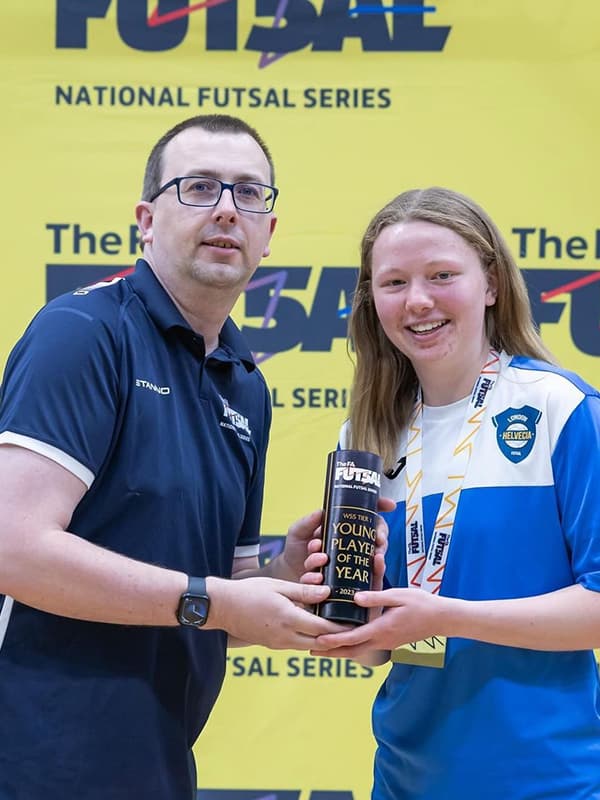 Alicia Grimmond receiving a Young Player of the Year Award