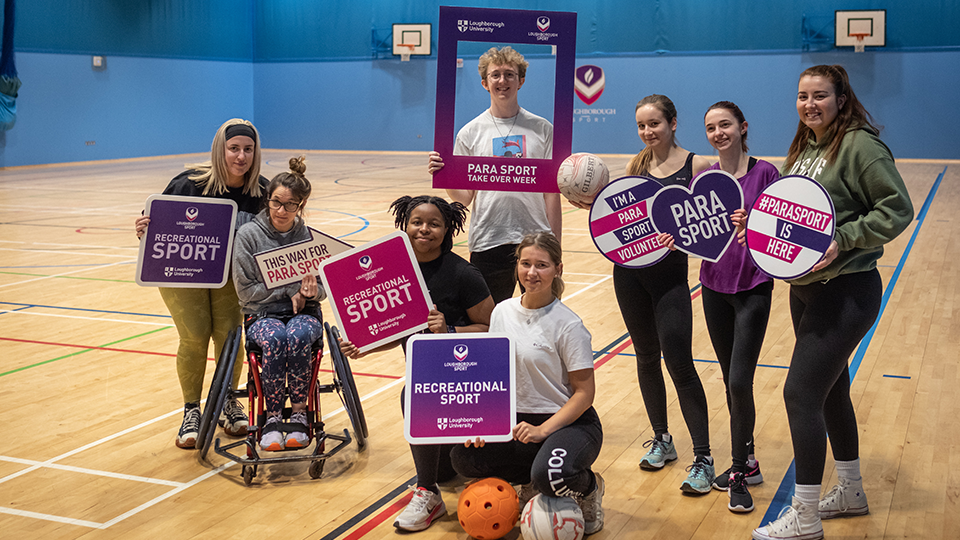 A mixture of students holding para sport signs