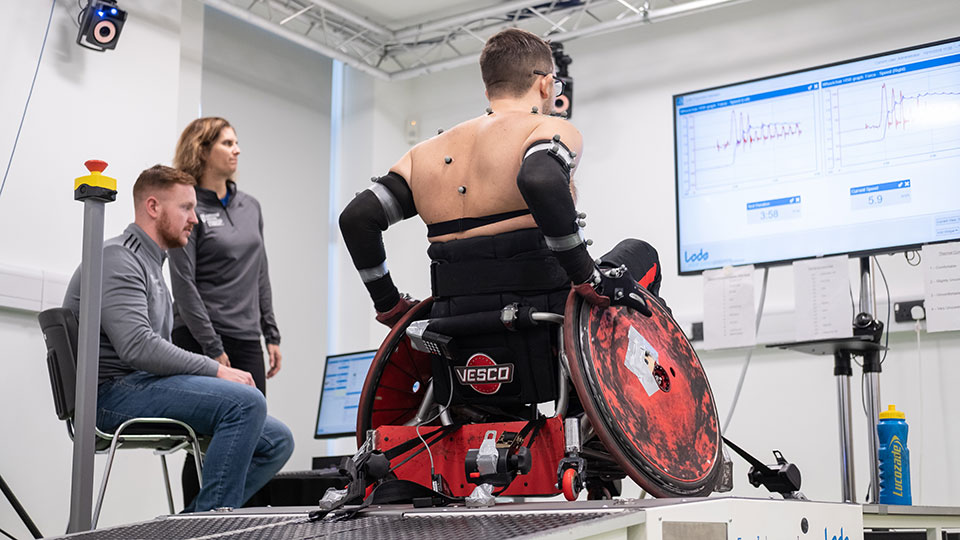 A parasport athlete in a wheelchair participating in research.