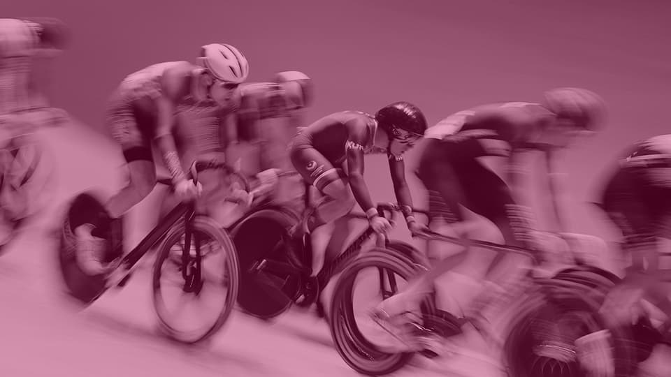 a group of cyclists on a track