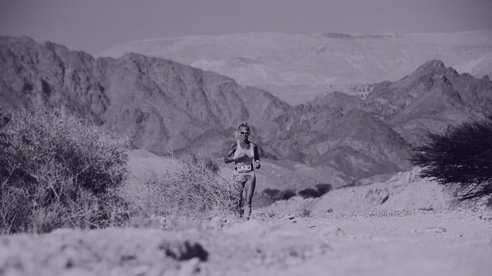 a runner in a desert landscape