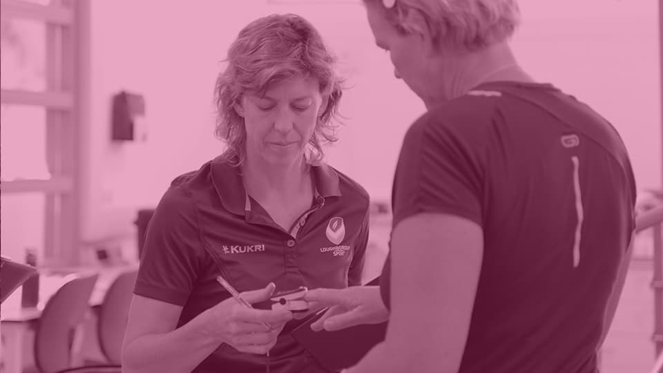 an athlete in a fitness testing lab with a mask over his nose and mouth
