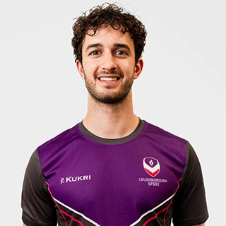 Aden is wearing a Loughborough Sport jumper and is smiling for a headshot.
