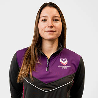 Chloe is wearing a Loughborough Sport jumper and is smiling for a headshot.