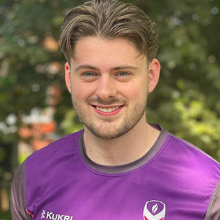 Dan is smiling, wearing a Loughborough Sport top.