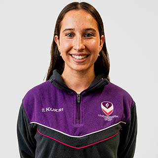 Ellie is wearing a Loughborough Sport jumper and is smiling for a headshot.