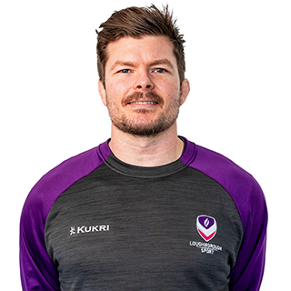 Guy is smiling for a headshot in Loughborough Sport kit.