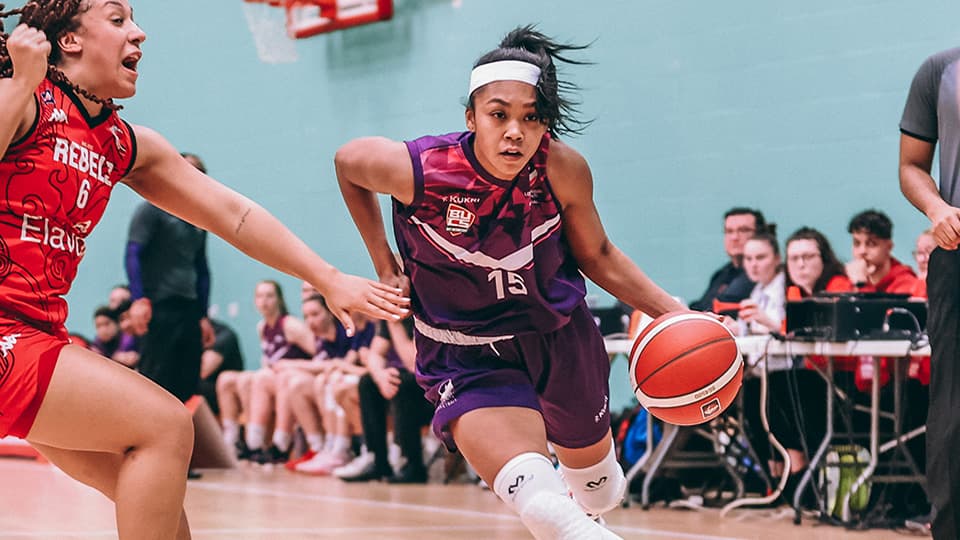 two basketball players during the game